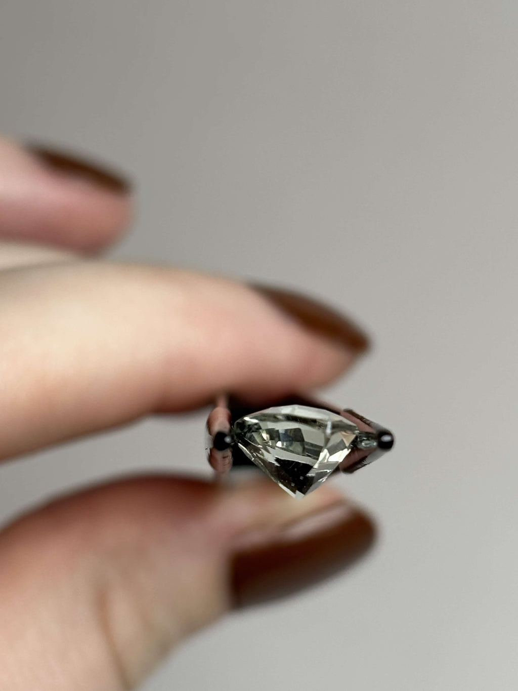 Side of trillion cut (triangular) light green stone 8 mm in size