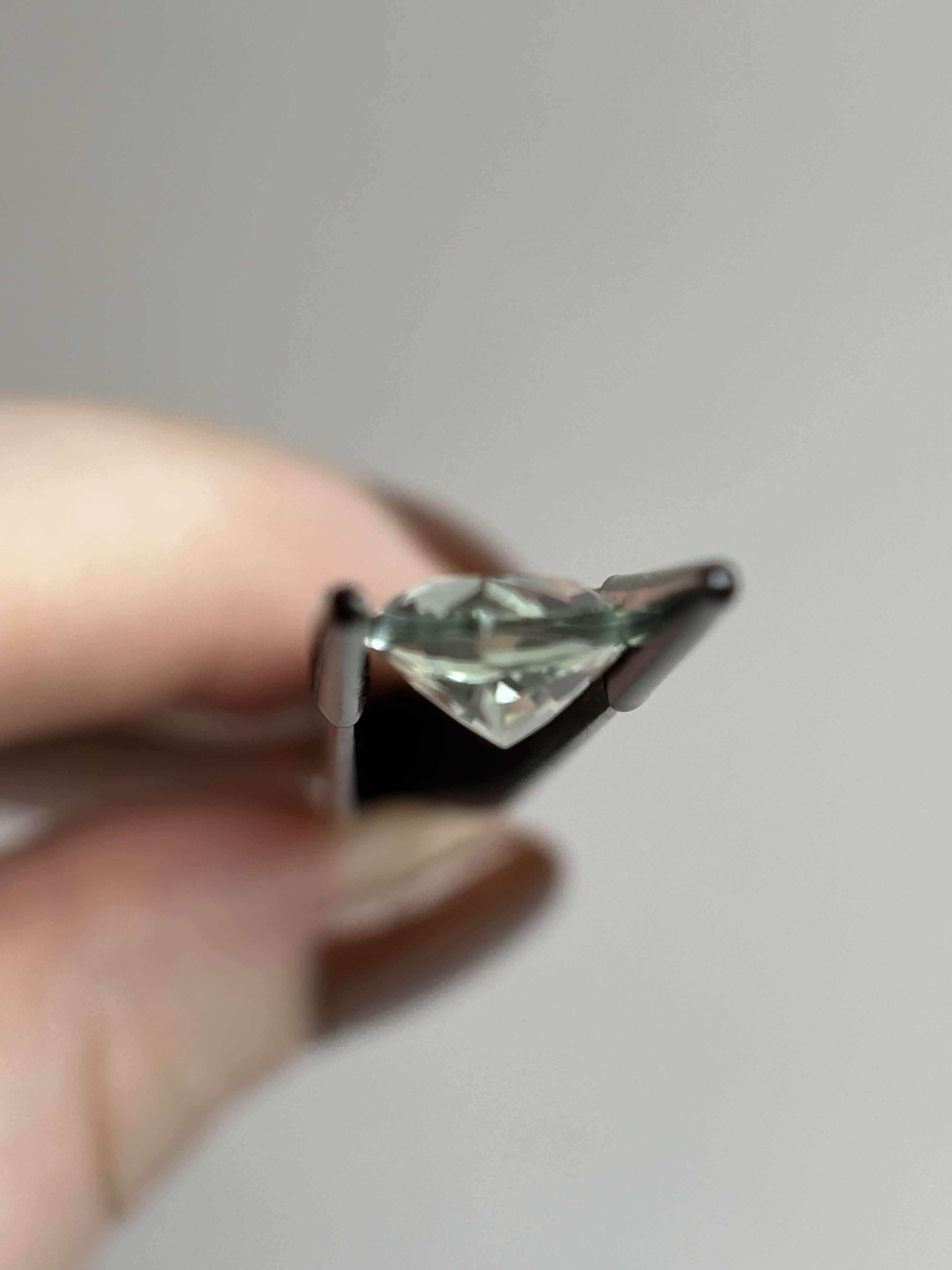 Side of pear shaped light green stone