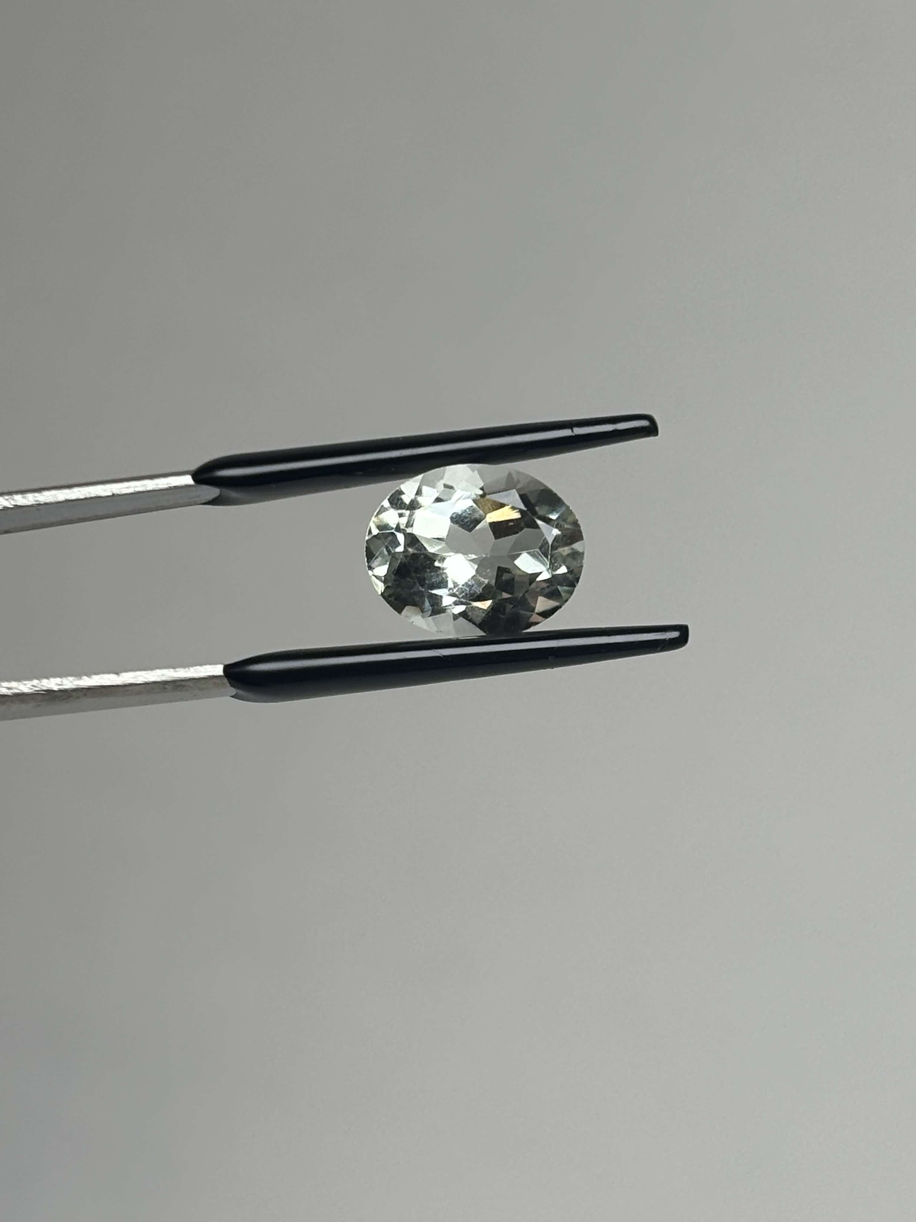 Front of light green oval stone