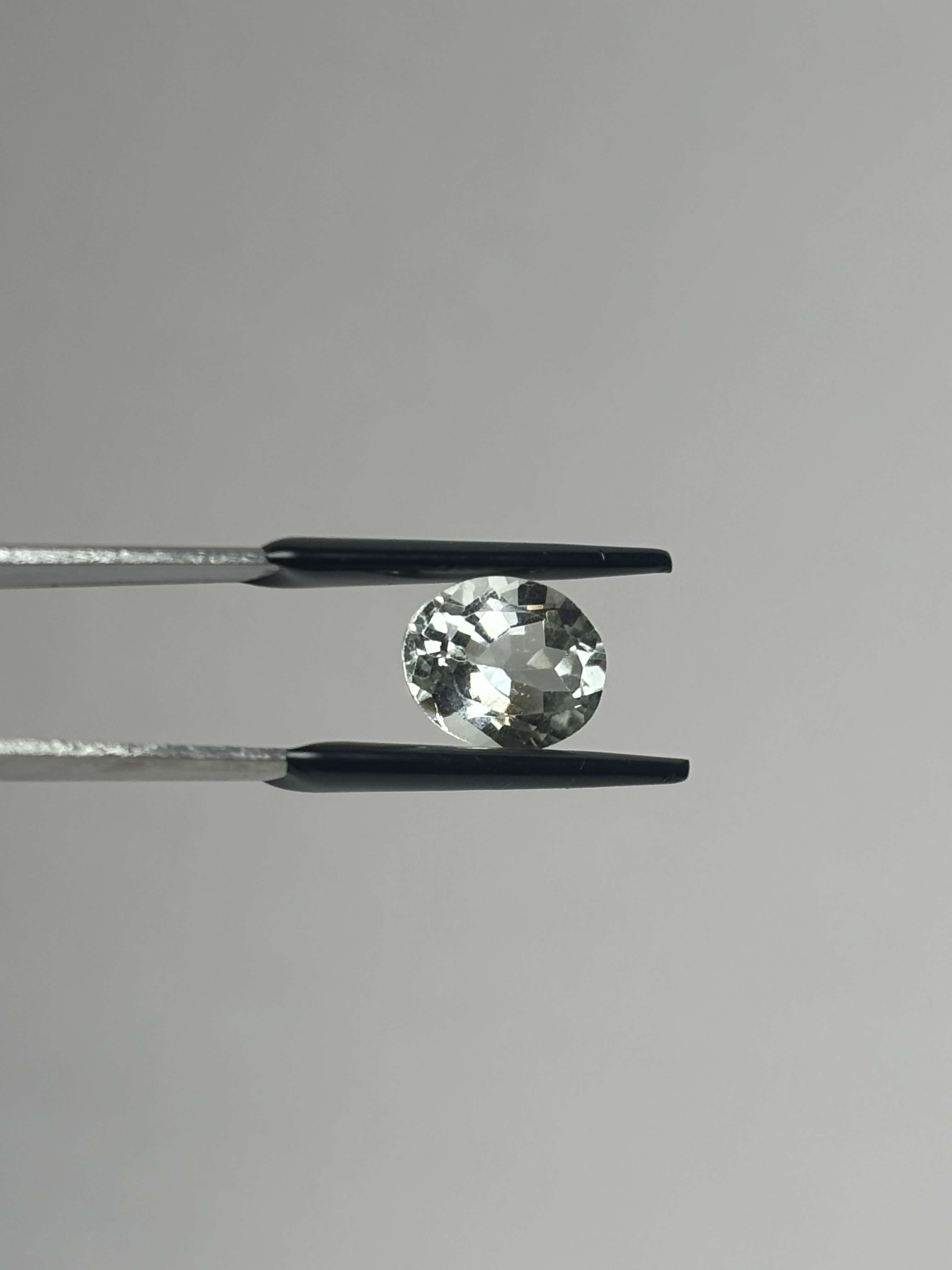 Front of light green oval stone