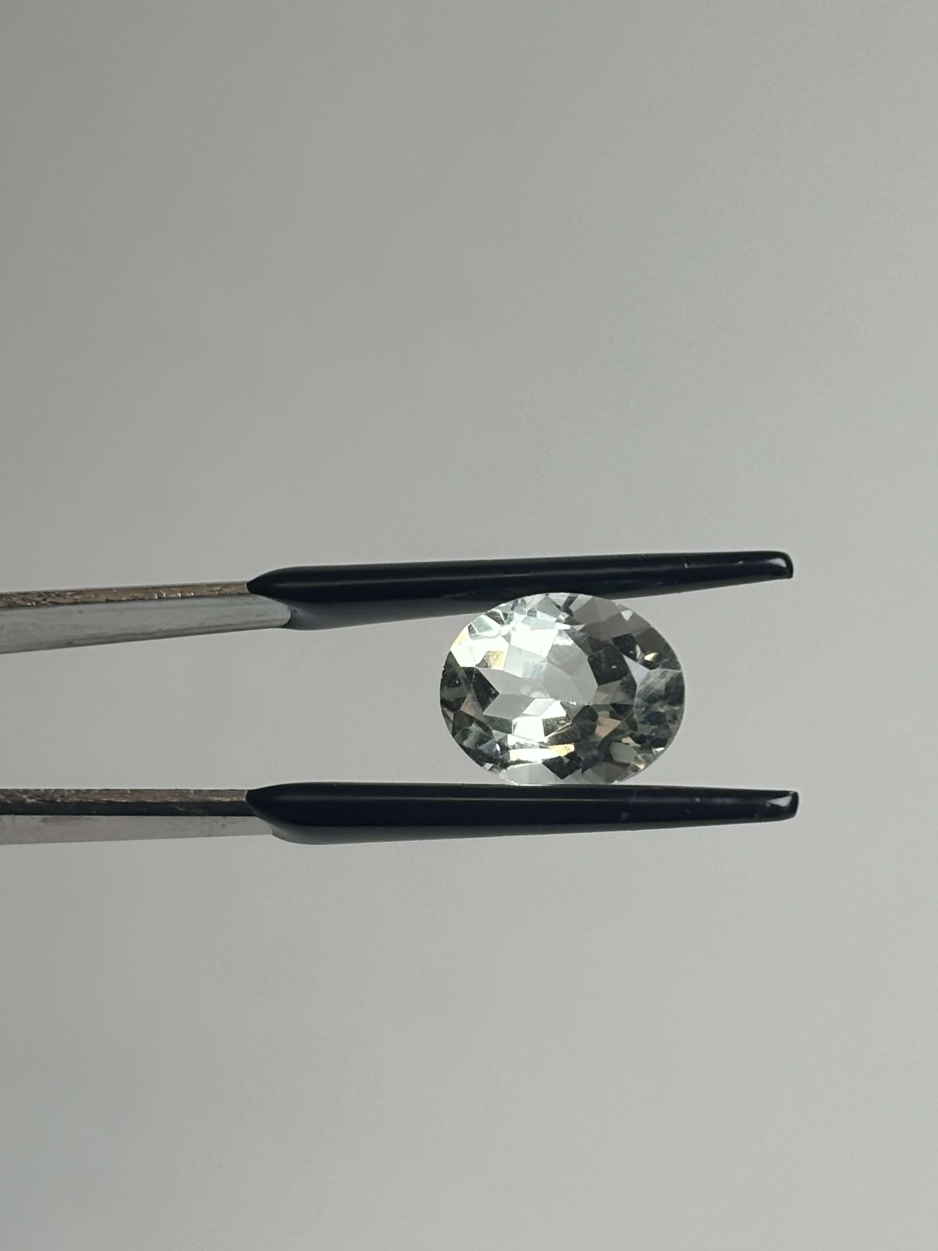 Front of light green oval stone