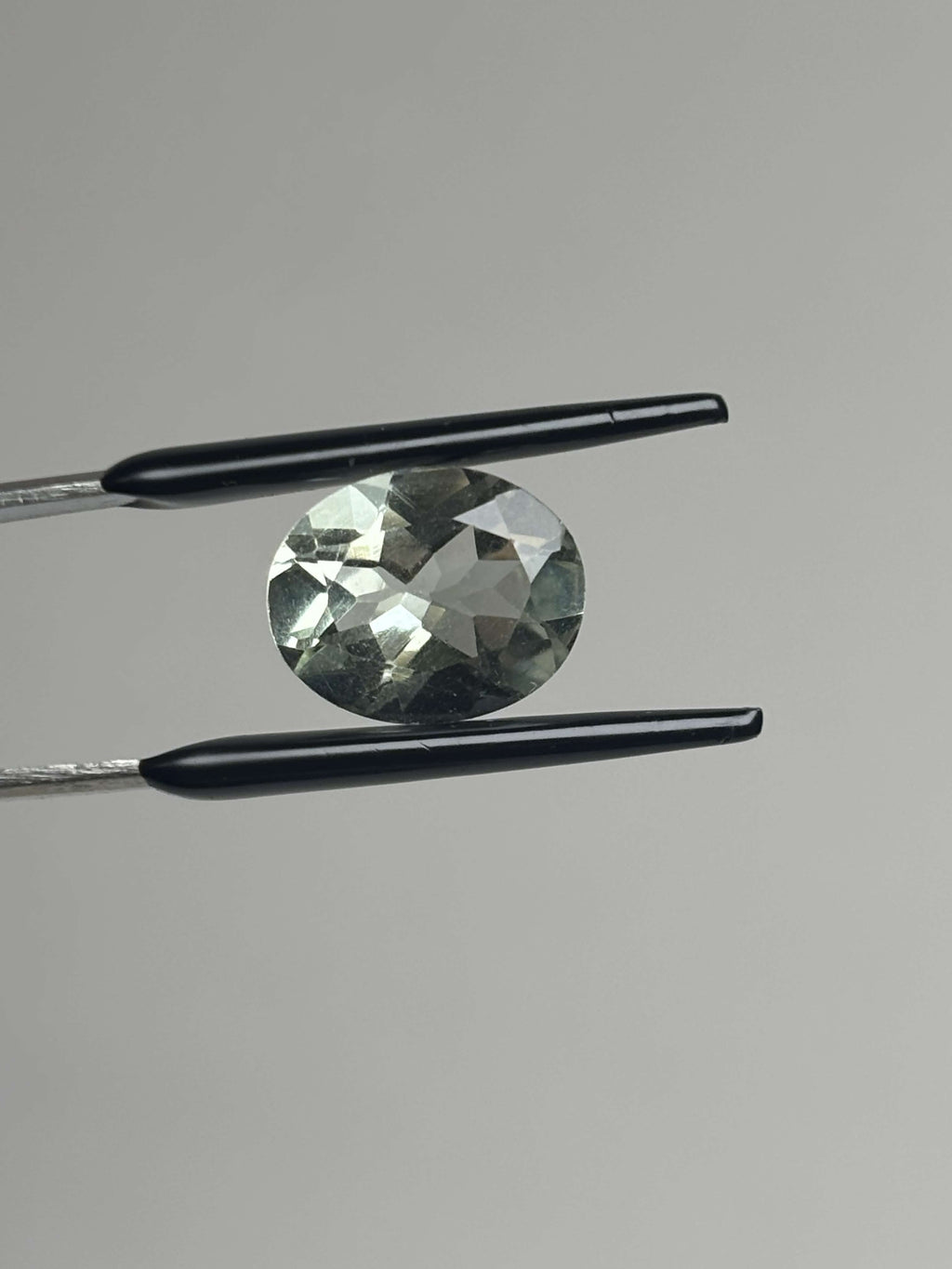 Front of pale green faceted stone