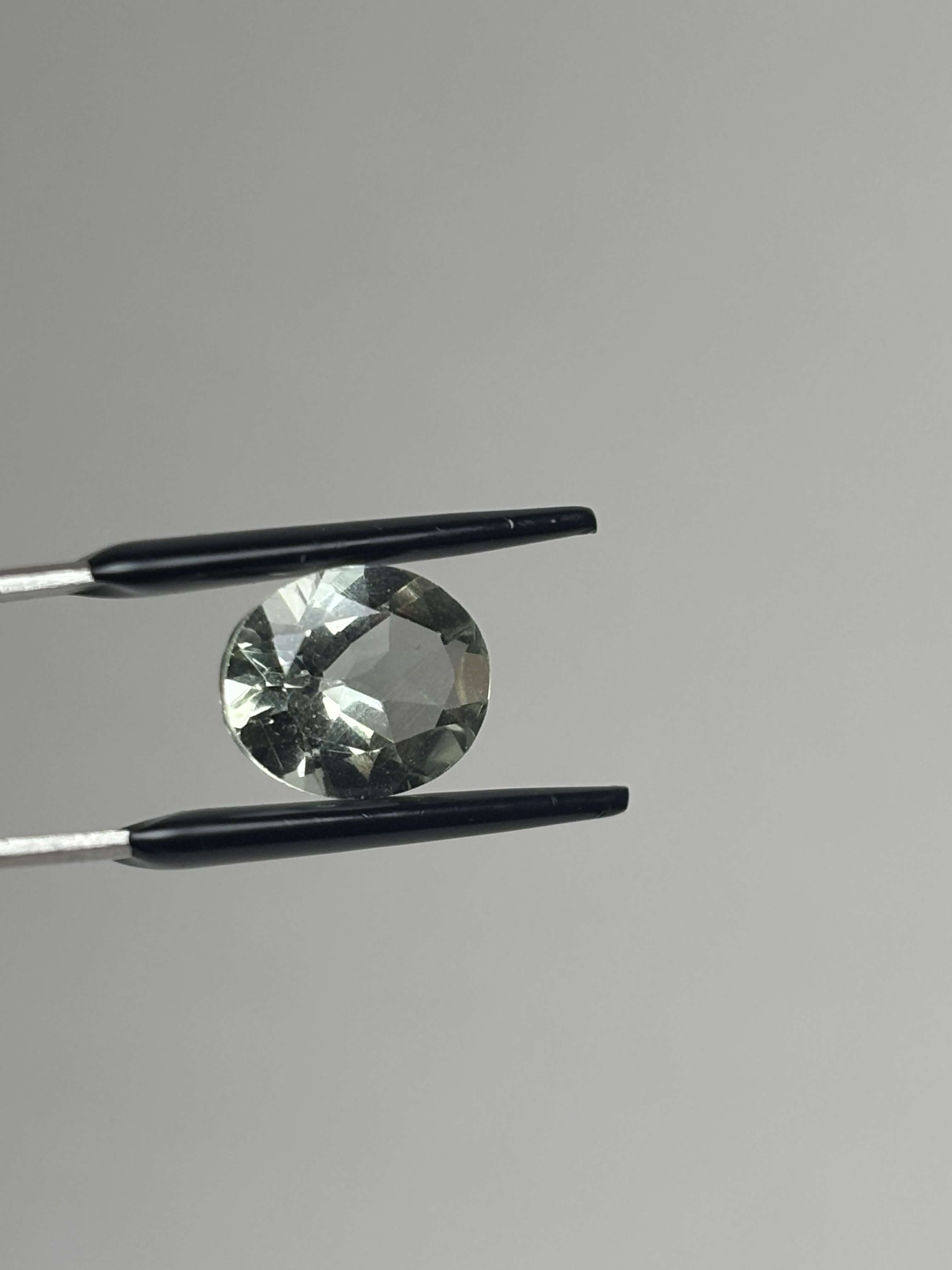 Front of pale green faceted stone