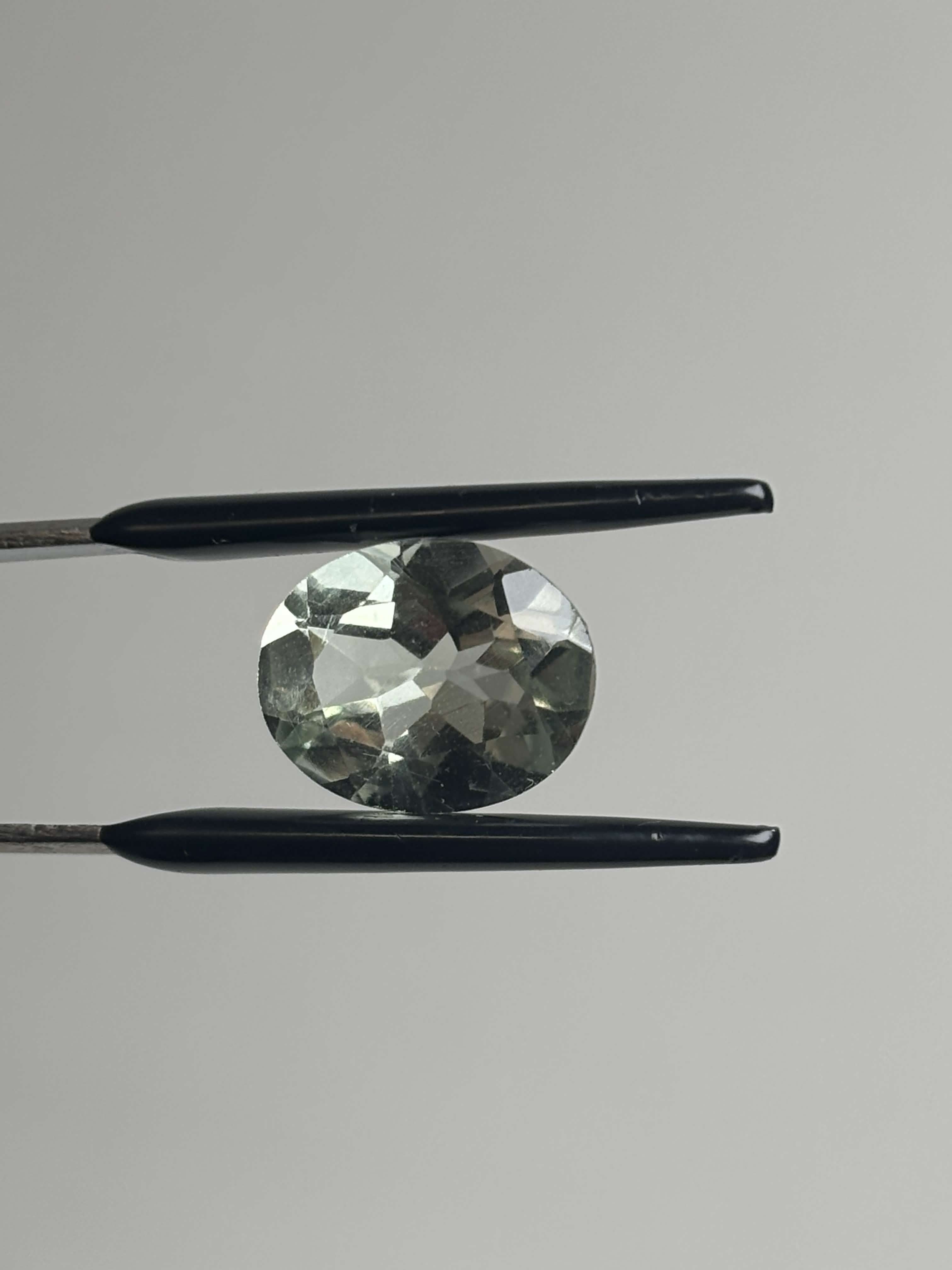 Front of pale green faceted stone