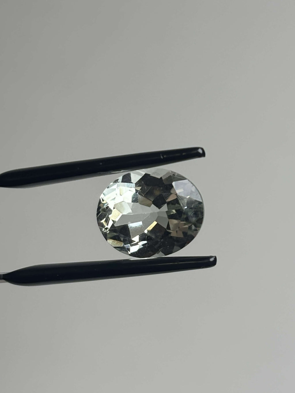 Front of pale green faceted stone