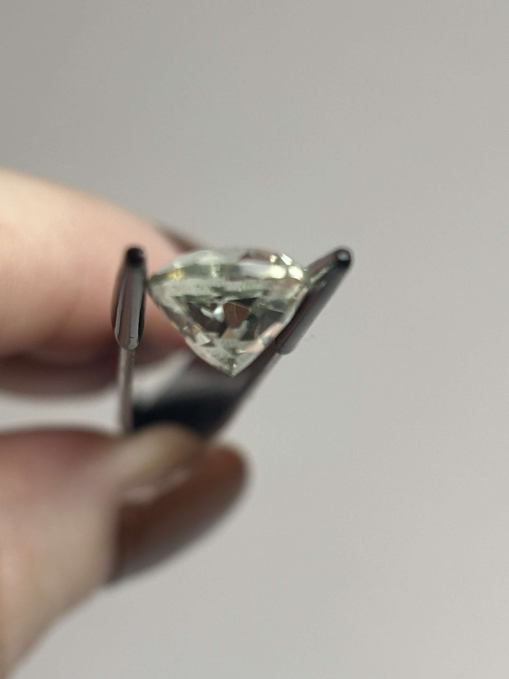 Side of pale green faceted stone